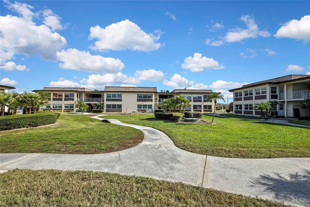 5242 Opal Lane, Unit 106 New Port Richey, FL 34652 - Photo 20 of 22 a view of a house with a backyard