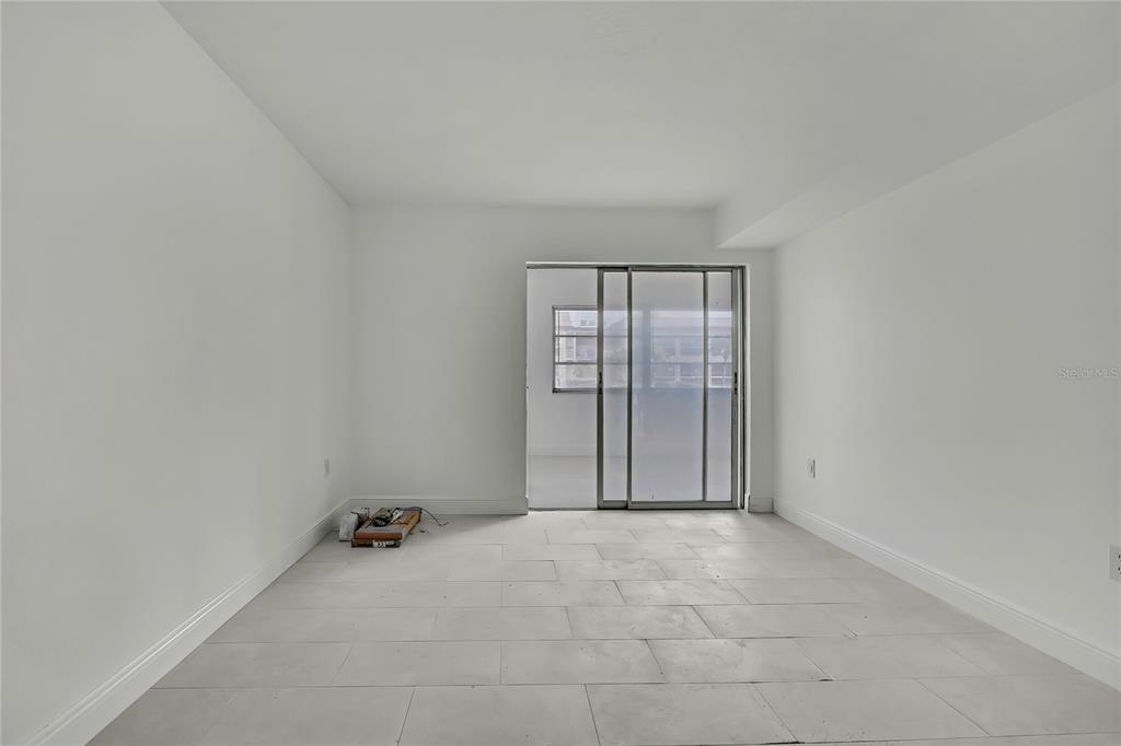 5242 Opal Lane, Unit 106 New Port Richey, FL 34652 - Photo 10 of 22 an empty room with windows