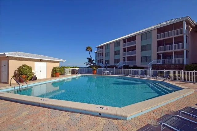 a view of a balcony with two chairs