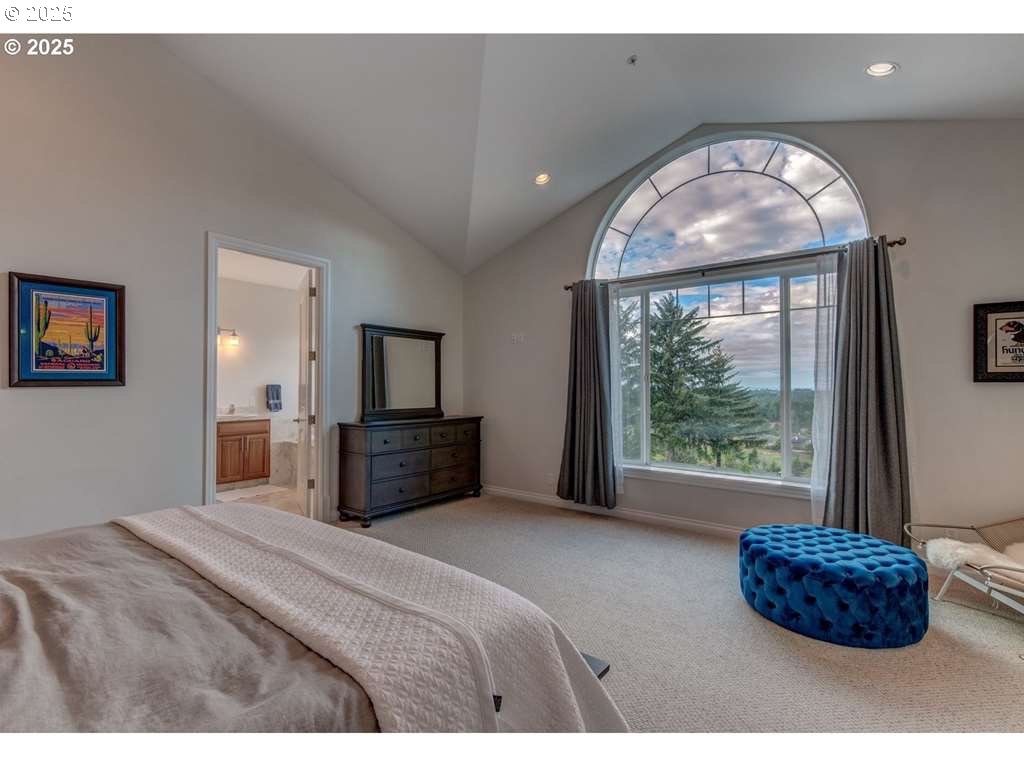 3562 Jake Mann Lane Florence, OR 97439 - Photo 13 of 18 a bedroom with a large bed and a large window