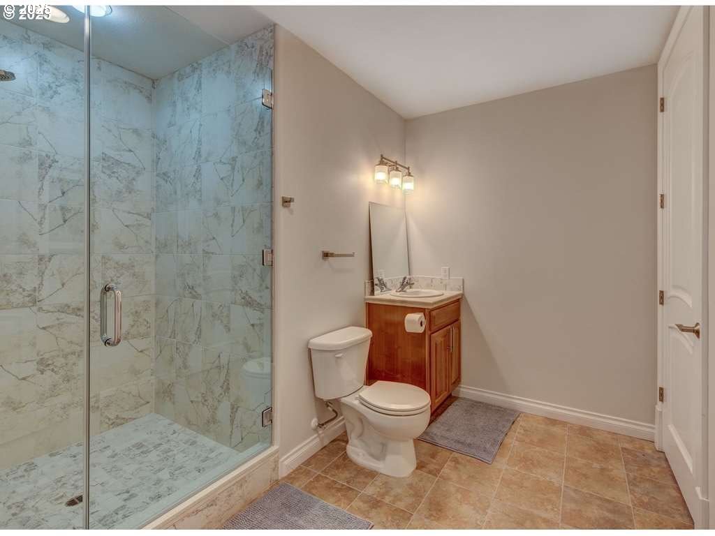 3562 Jake Mann Lane Florence, OR 97439 - Photo 7 of 18 a bathroom with a toilet and a shower