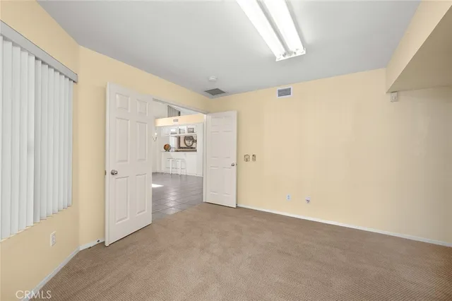a view of a hallway with closet
