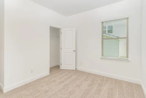 a bathroom with a granite countertop sink a toilet and bathtub