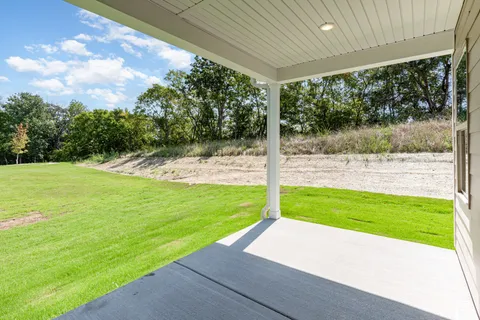 a view of an empty room with a fireplace