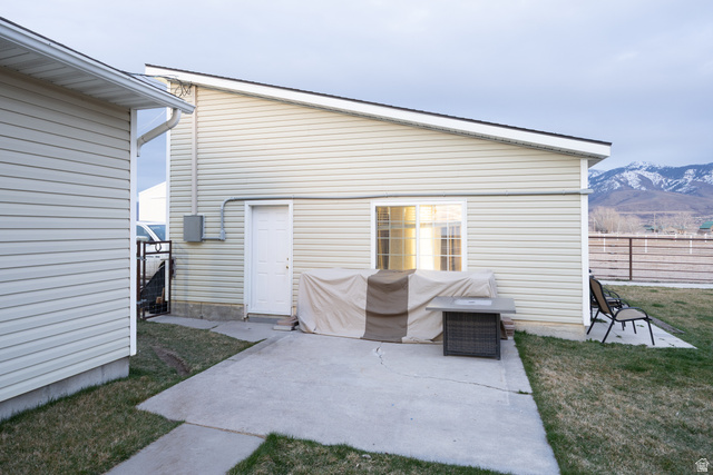 1981 South Main Street Lewiston, UT 84320 - Photo 21 of 47 Back of property featuring a patio and a mountain view