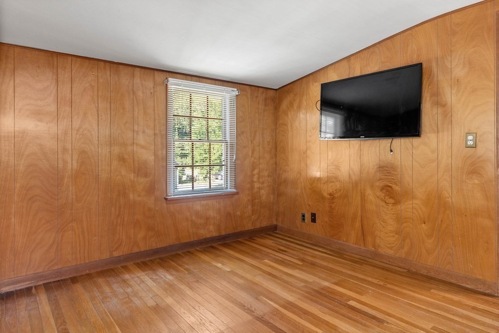 170 County Road Ipswich, MA 01938 - Photo 26 of 41 a view of a livingroom with wooden floor and a flat screen tv