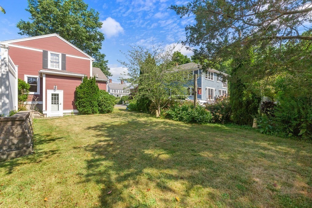 170 County Road Ipswich, MA 01938 - Photo 31 of 41 a view of a yard in front of a house with large trees