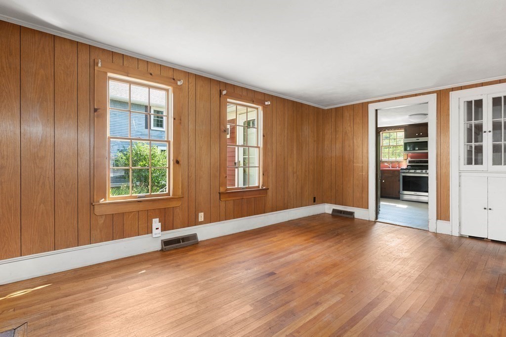 170 County Road Ipswich, MA 01938 - Photo 8 of 41 an empty room with wooden floor and windows