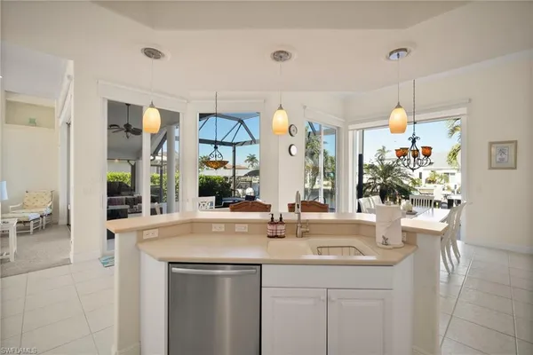 a view of living room with a sink and chandelier