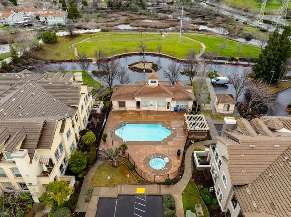 an aerial view of a house with a swimming pool
