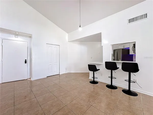 a view of an empty room with windows