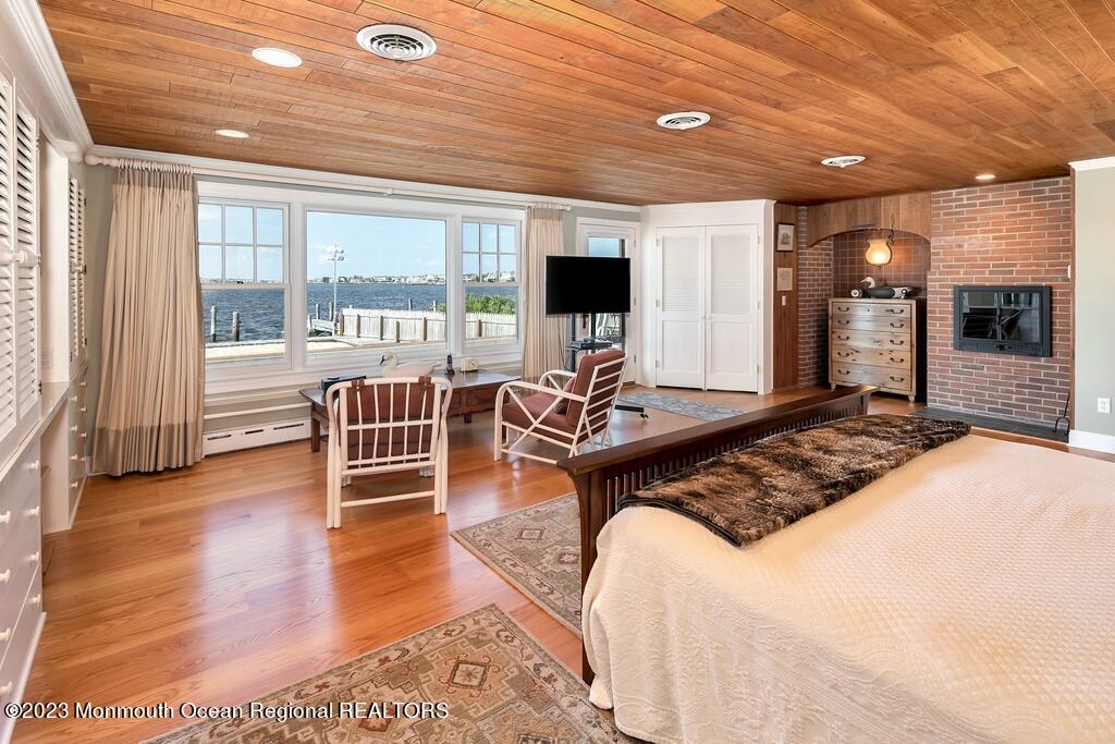 127 Curtis Point Drive Mantoloking, NJ 08738 - Photo 11 of 34 a living room with furniture and a flat screen tv