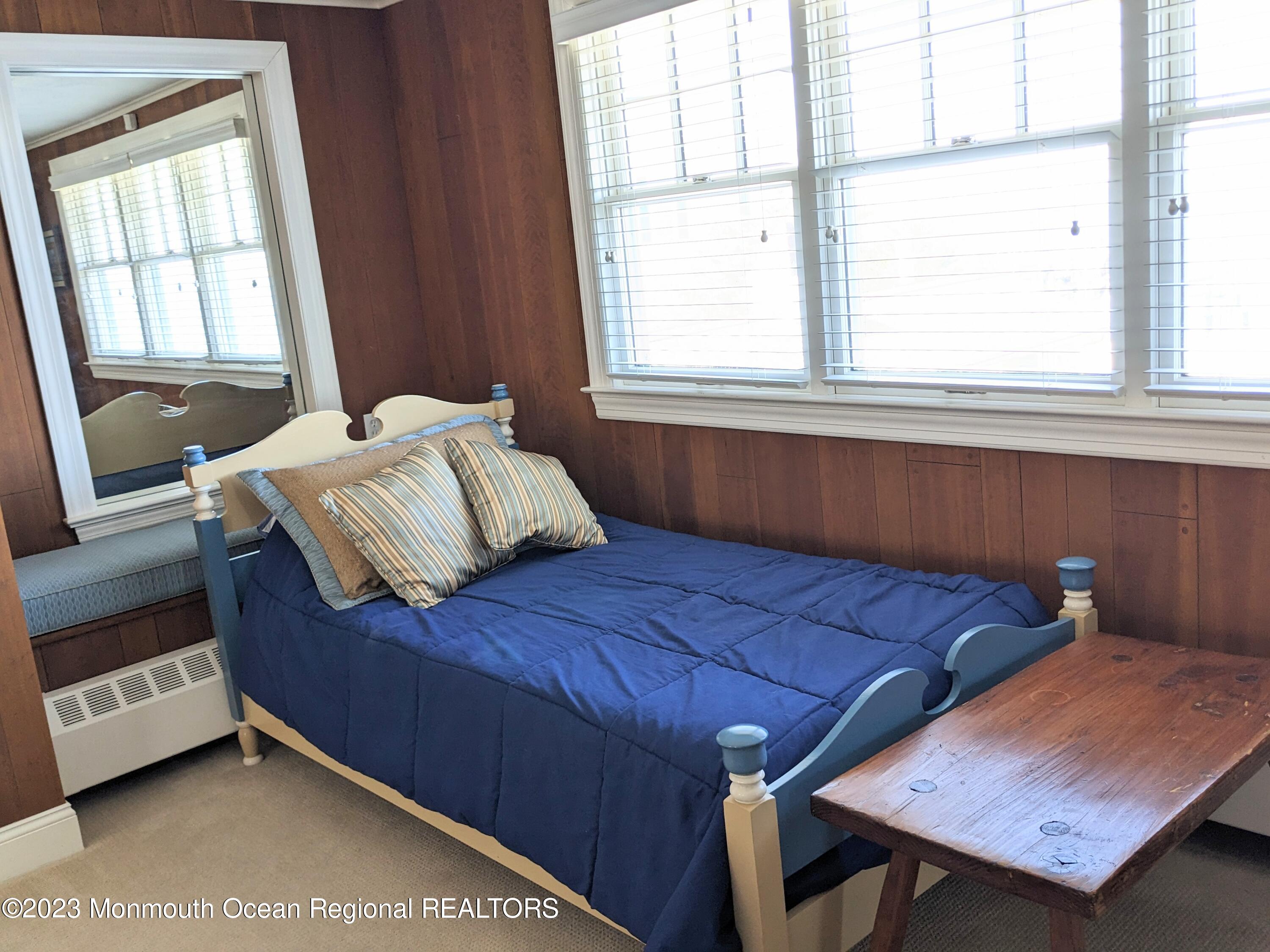 127 Curtis Point Drive Mantoloking, NJ 08738 - Photo 22 of 34 a bedroom with a bed and windows
