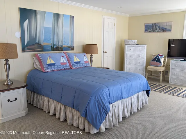 a bedroom with two beds and painted walls