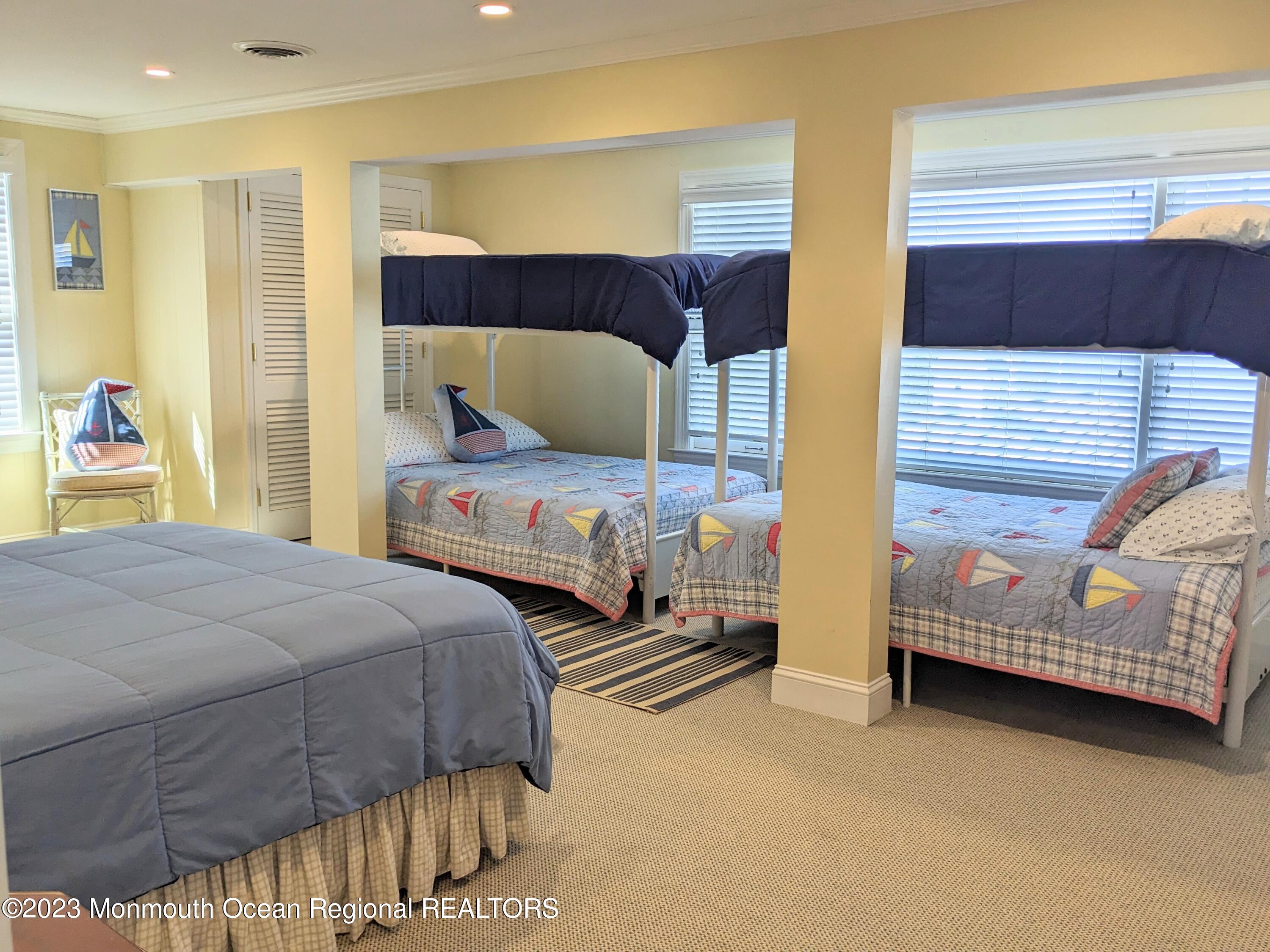 127 Curtis Point Drive Mantoloking, NJ 08738 - Photo 24 of 34 a bedroom with two beds and painted walls