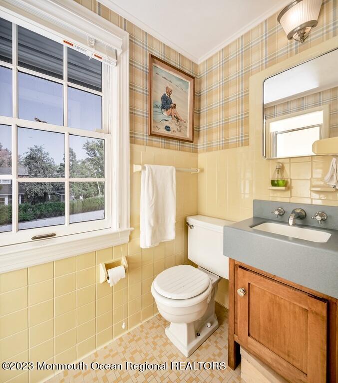 127 Curtis Point Drive Mantoloking, NJ 08738 - Photo 25 of 34 a bathroom with a toilet sink and mirror