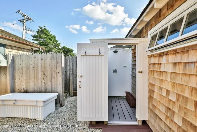 a view of swimming pool with outdoor seating and yard in the back