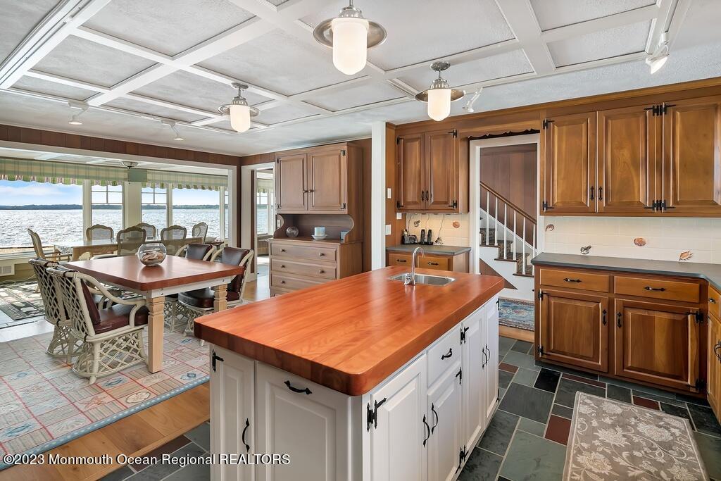 127 Curtis Point Drive Mantoloking, NJ 08738 - Photo 6 of 34 a kitchen with stainless steel appliances granite countertop a stove a sink and a refrigerator