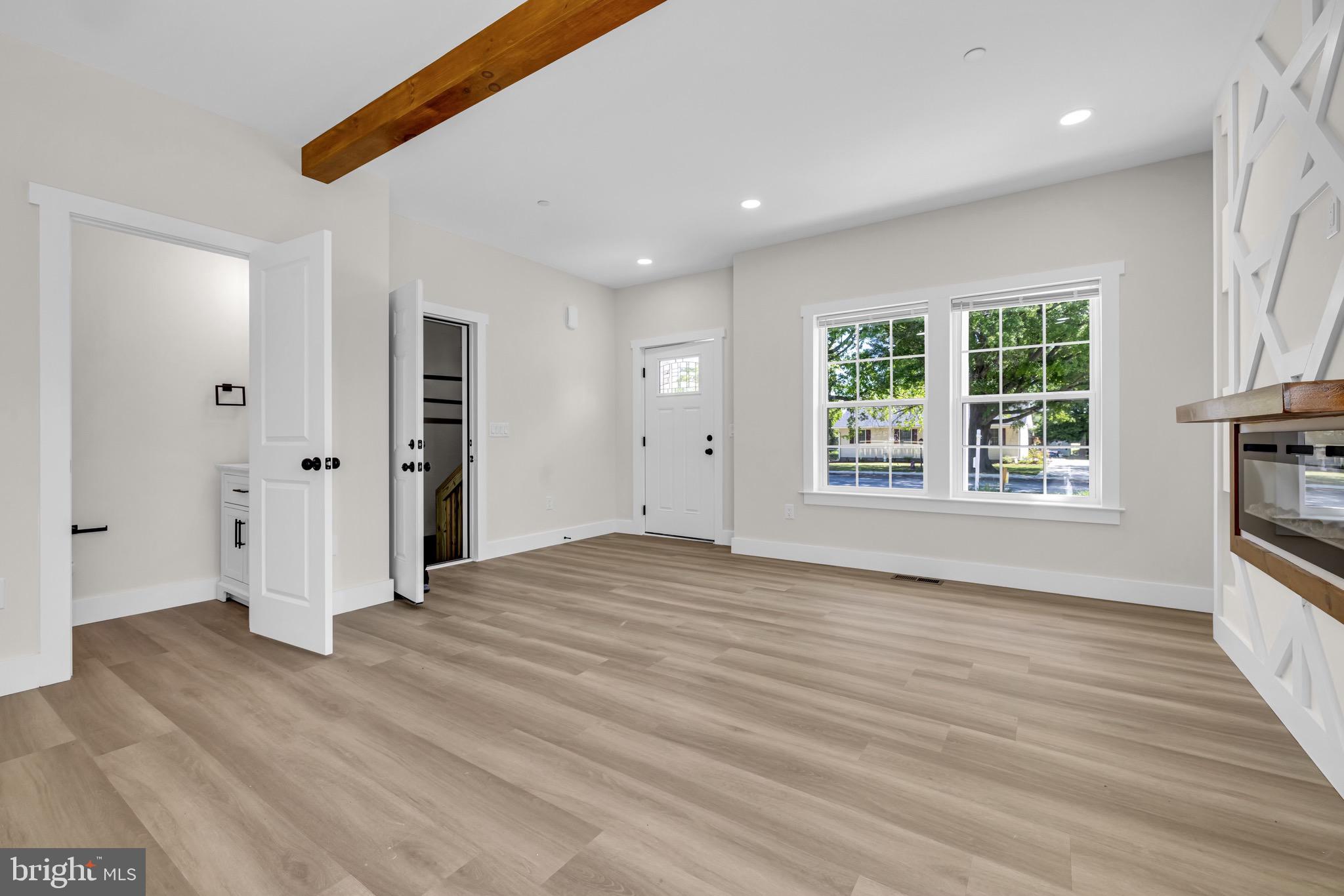 1 Sunrise Avenue Ridgely, MD 21660 - Photo 5 of 28 an empty room with wooden floor and windows