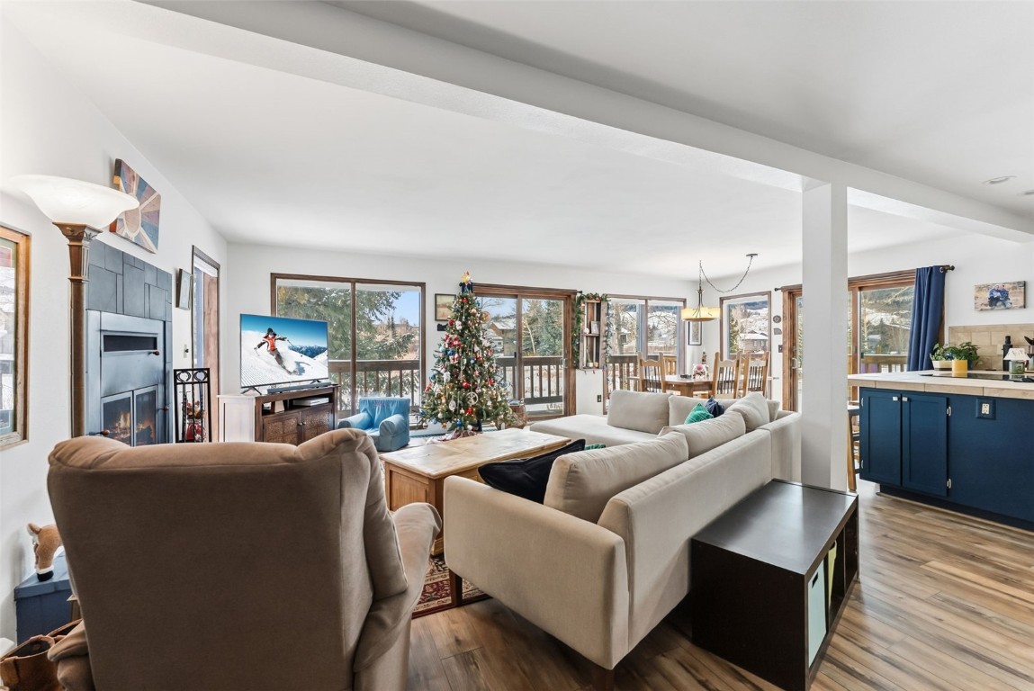 460 Clayton Road Silverthorne, CO 80498 - Photo 1 of 50 a living room with furniture large windows and wooden floor