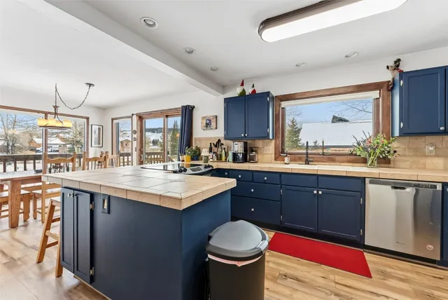 a kitchen with a sink and cabinets