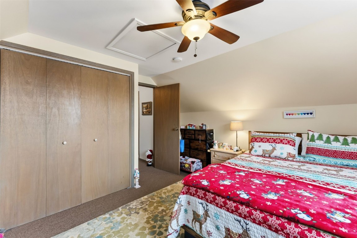 460 Clayton Road Silverthorne, CO 80498 - Photo 32 of 50 a bedroom with a bed and a dresser