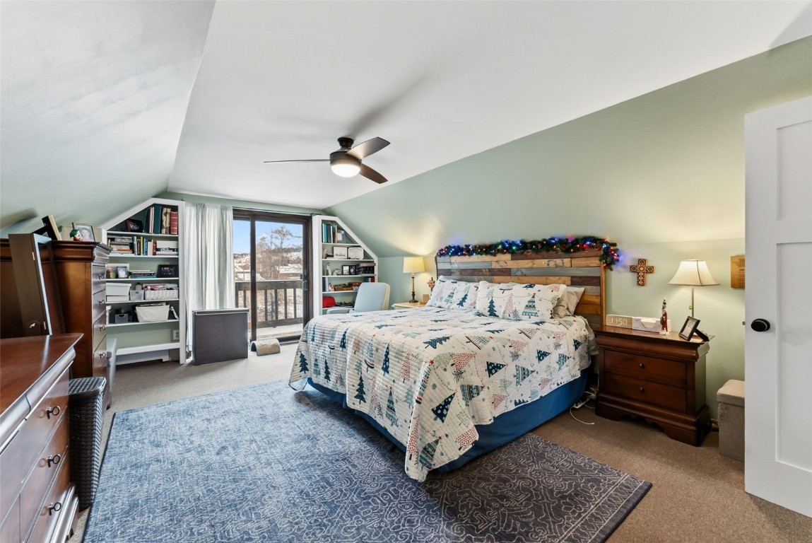 460 Clayton Road Silverthorne, CO 80498 - Photo 33 of 50 a bedroom with a bed furniture and a flat tv screen