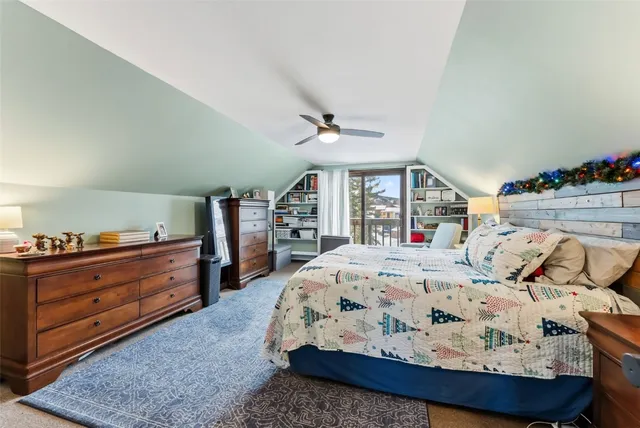 a bed room with a bed and a window