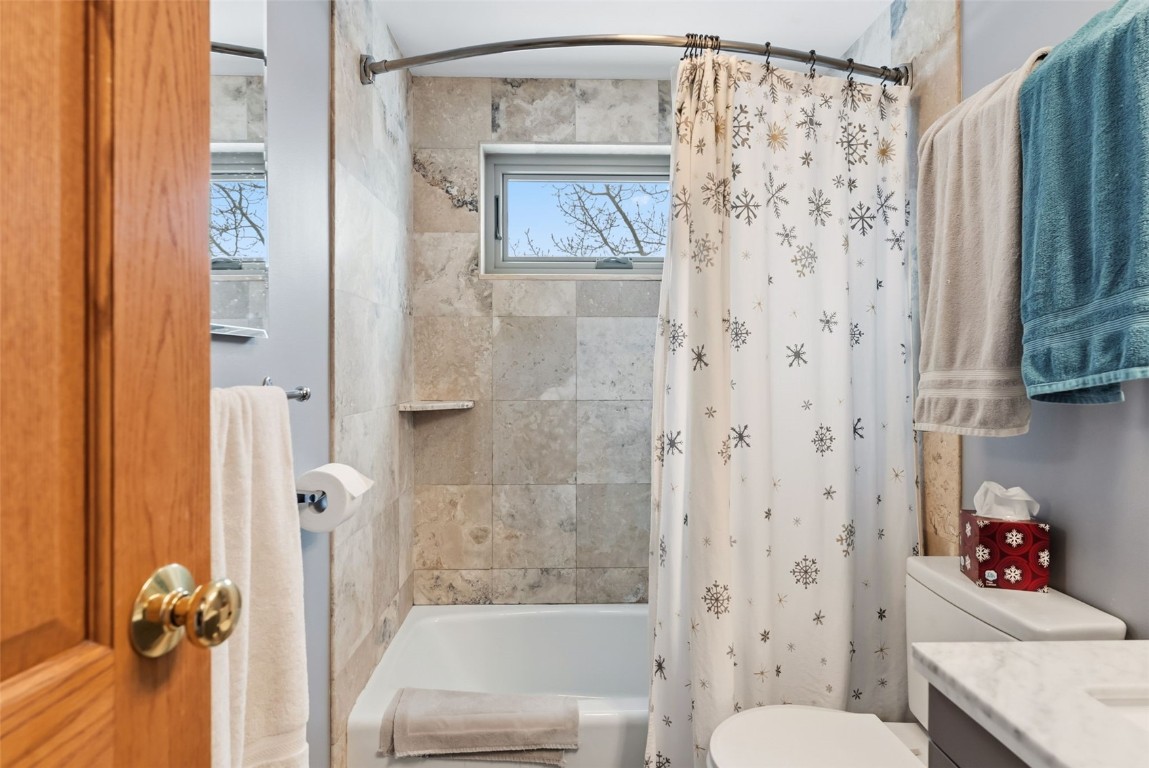 460 Clayton Road Silverthorne, CO 80498 - Photo 39 of 50 a bathroom with a shower curtain mirror and a toilet
