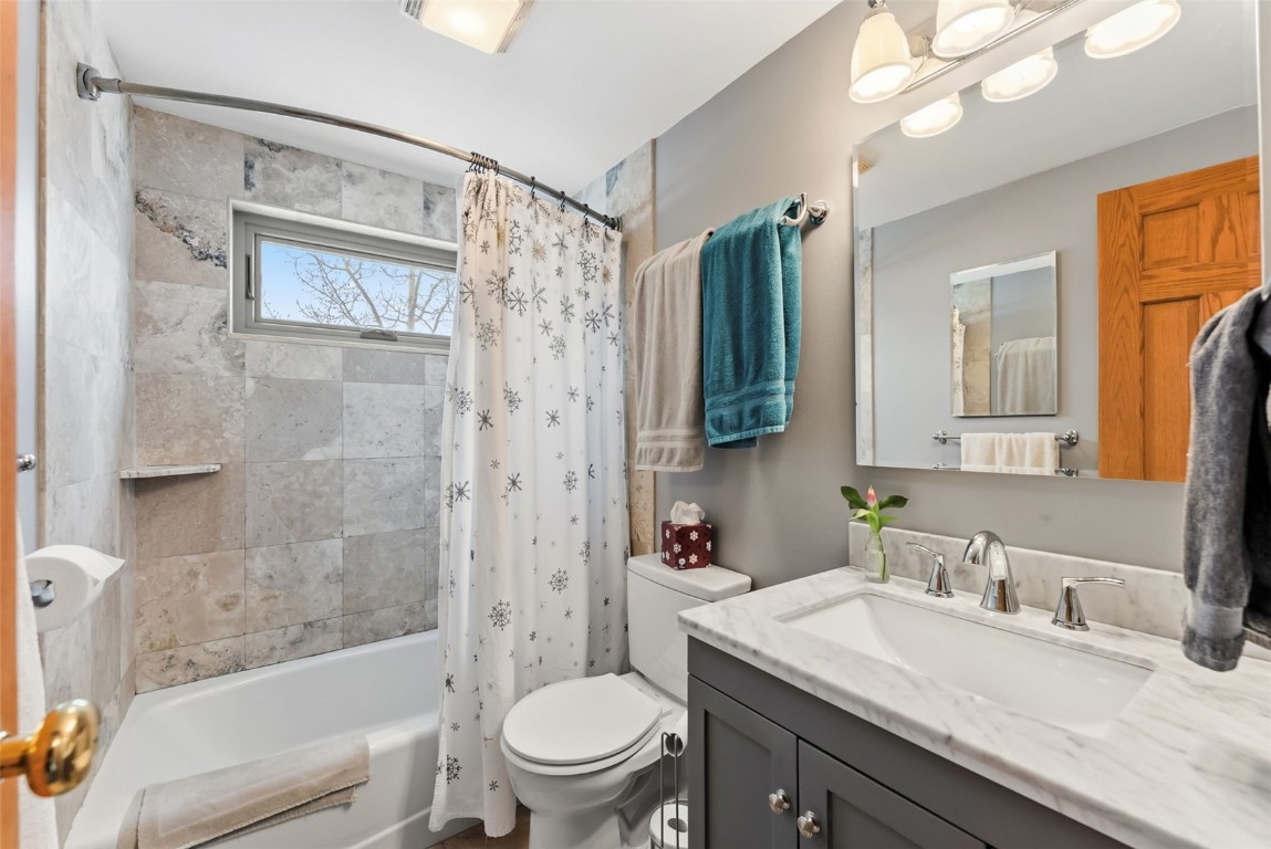 460 Clayton Road Silverthorne, CO 80498 - Photo 40 of 50 a bathroom with a granite countertop sink toilet and shower