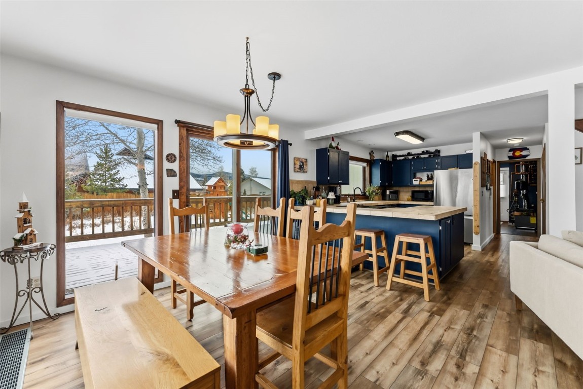 460 Clayton Road Silverthorne, CO 80498 - Photo 8 of 50 a view of a dining room with furniture window and wooden floor