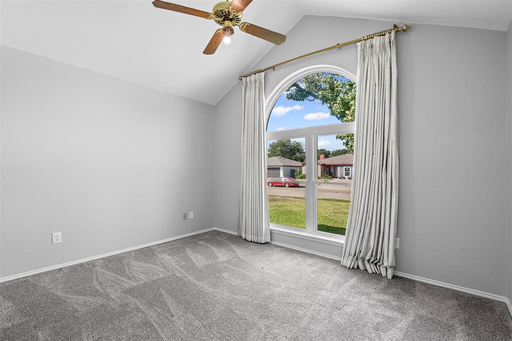 7301 Wagonwheel Road Fort Worth, TX 76133 - Photo 15 of 34 an empty room with a window and front door