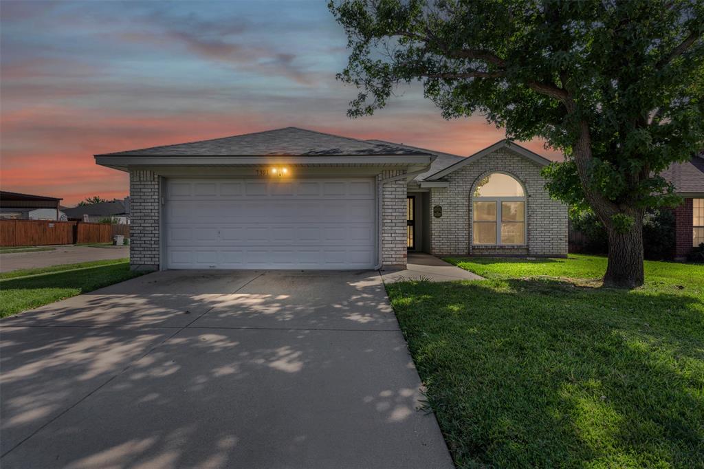 7301 Wagonwheel Road Fort Worth, TX 76133 - Photo 2 of 34 a front view of house with yard and green space
