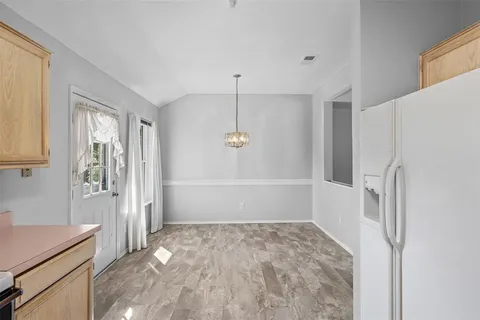 a bathroom with a granite countertop shower and a sink