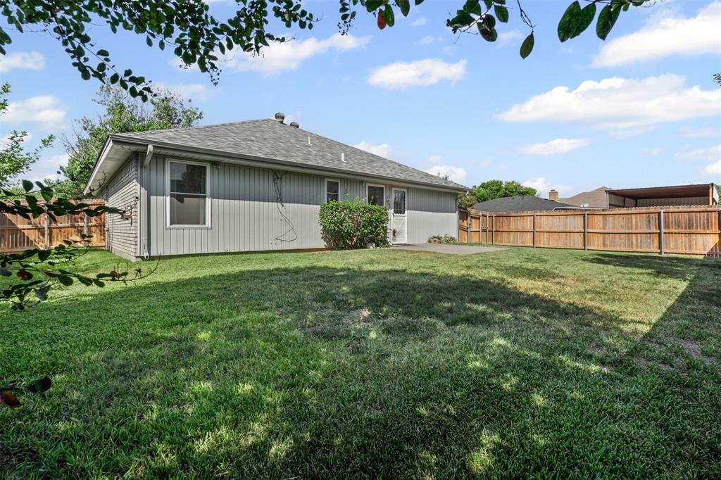 7301 Wagonwheel Road Fort Worth, TX 76133 - Photo 29 of 34 a view of a house with a yard