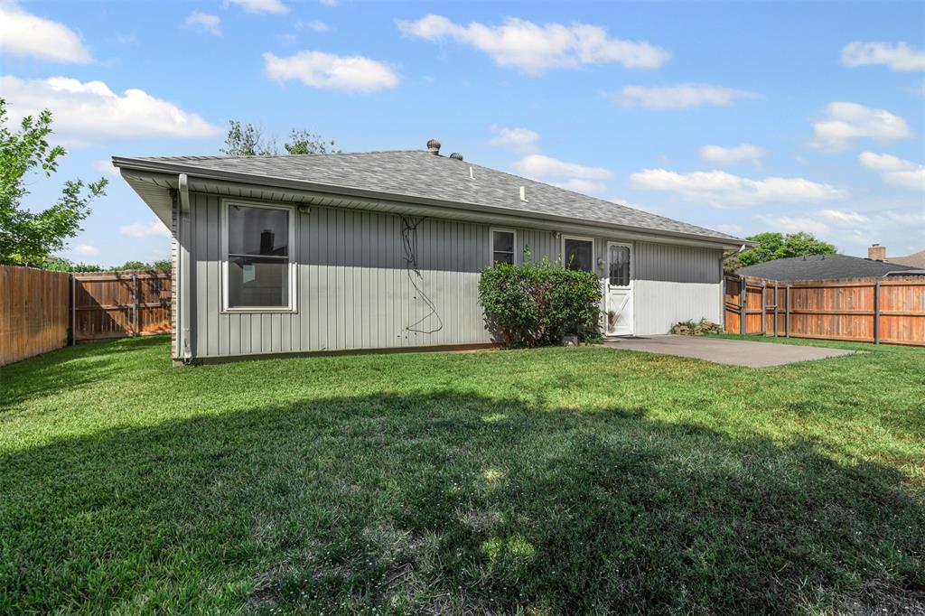 7301 Wagonwheel Road Fort Worth, TX 76133 - Photo 30 of 34 a view of a house with a backyard