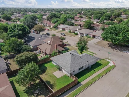an aerial view of a house with a garden