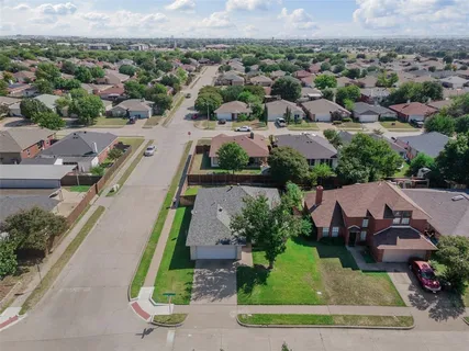 an aerial view of a house with a garden