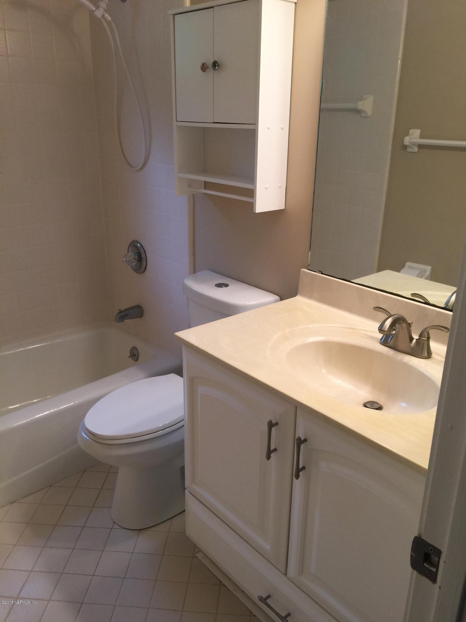 12018 Mandarin Road Jacksonville, FL 32223 - Photo 23 of 33 a bathroom with a sink a toilet and shower