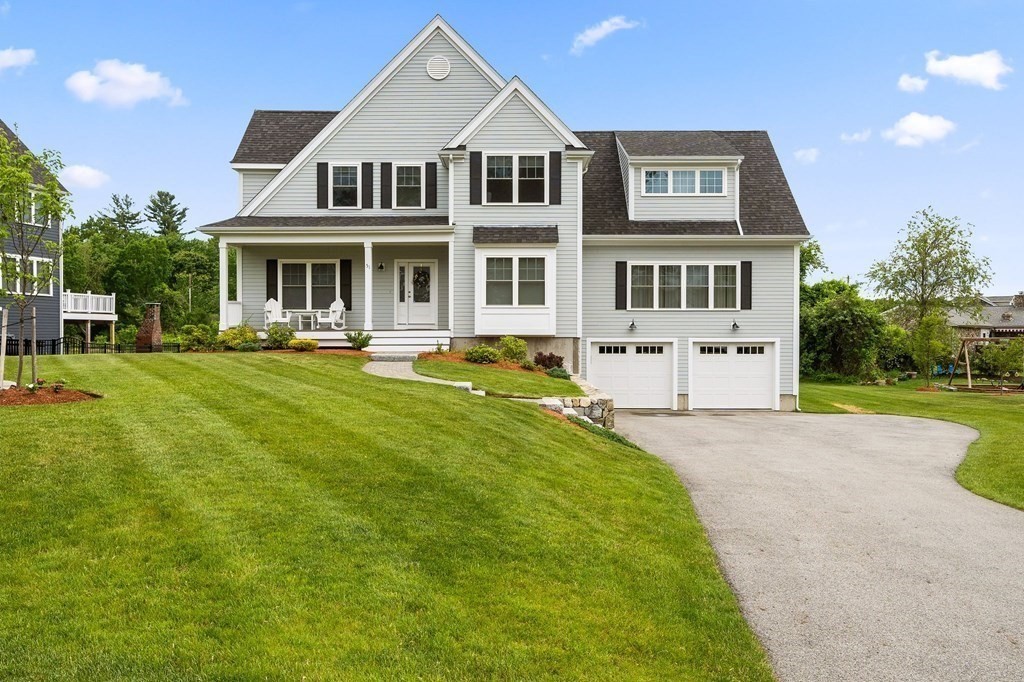 51 Tamarack Road Dracut, MA 01826 - Photo 1 of 39 a front view of a house with a yard