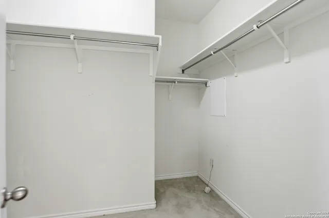 a view of an empty walk in closet