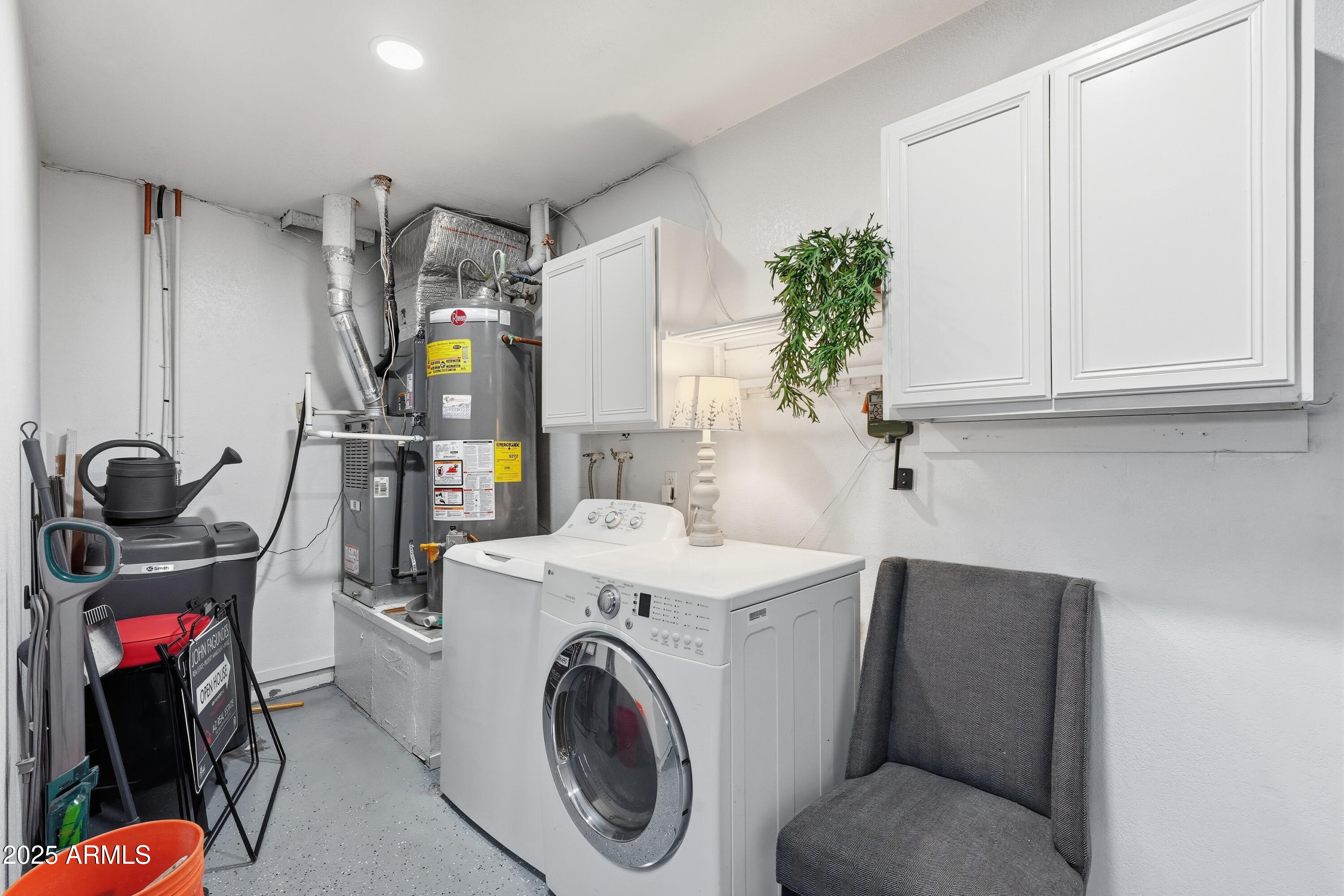 5632 South Jolly Roger Road Tempe, AZ 85283 - Photo 17 of 35 a utility room with dryer washer and a view of living room