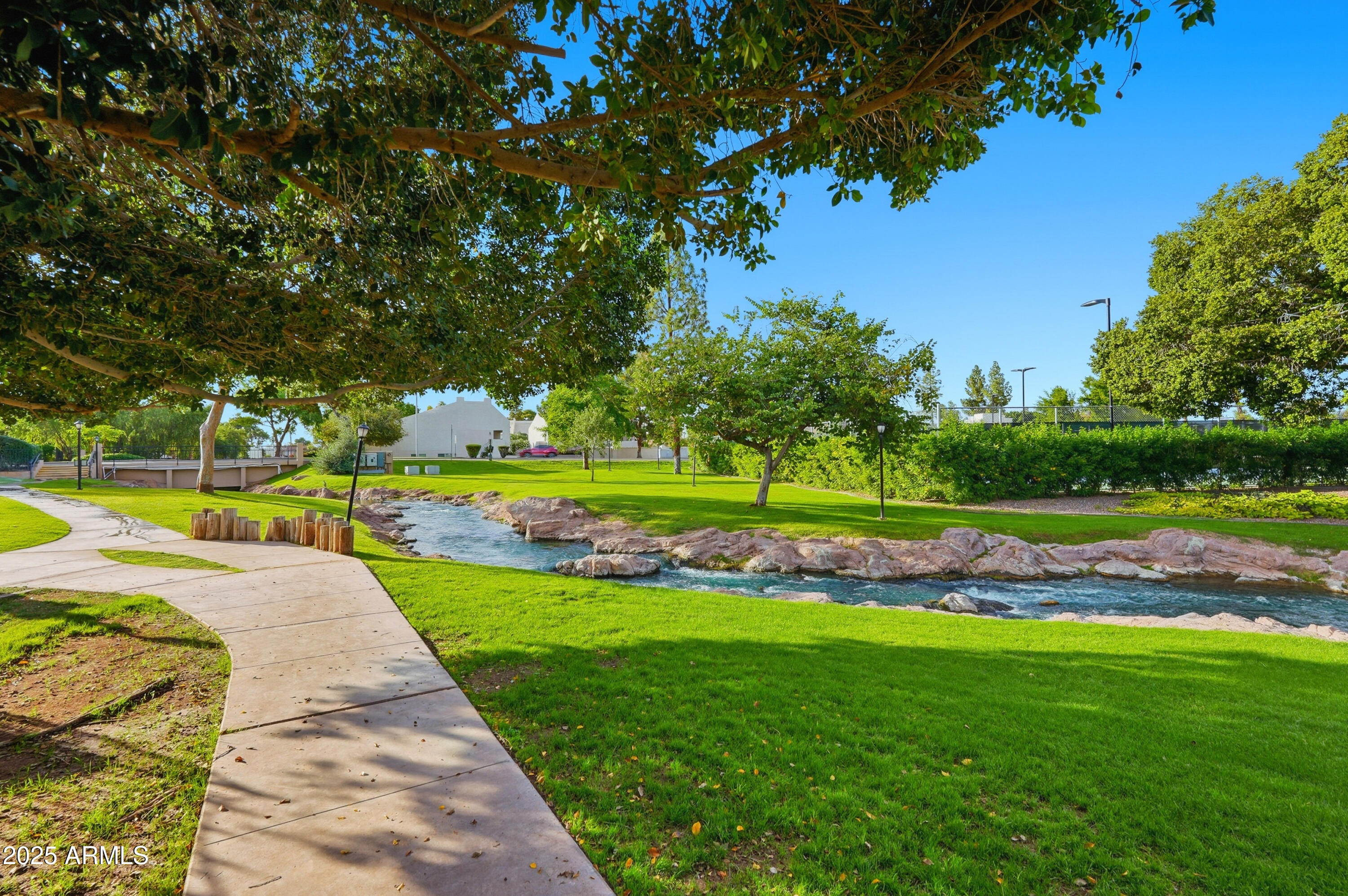 5632 South Jolly Roger Road Tempe, AZ 85283 - Photo 28 of 35 a view of yard with swimming pool and green space