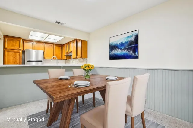 a view of a dining room with furniture and window