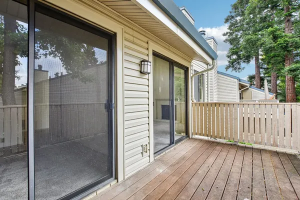a bed sitting in a room next to a window