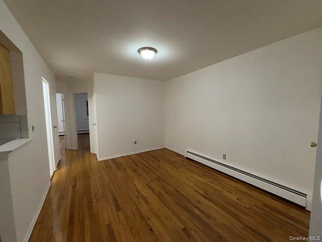1020 Throggmorton Avenue, Unit 1 Bronx, NY 10465 - Photo 8 of 11 a view of empty room with wooden floor