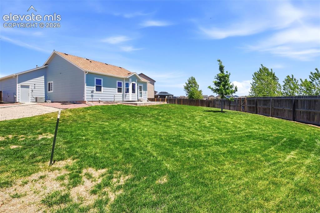 7806 Dutch Loop Colorado Springs, CO 80925 - Photo 33 of 41 a house view with a garden space