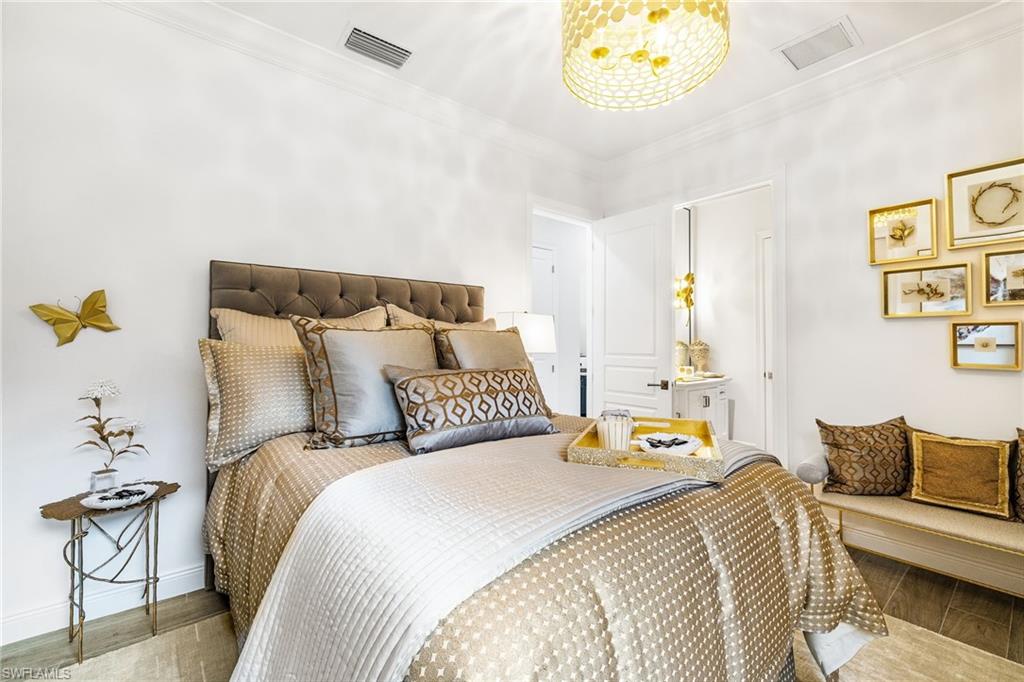 14480 Marsala Way Naples, FL 34109 - Photo 16 of 31 a bedroom with a bed and a couch