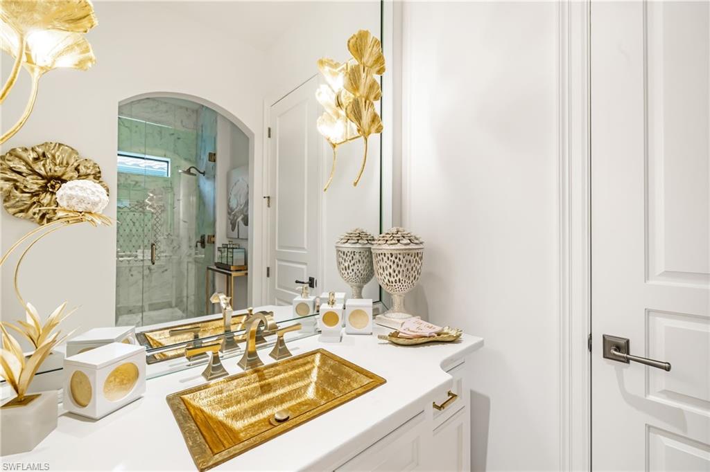 14480 Marsala Way Naples, FL 34109 - Photo 17 of 31 a bathroom with a sink vanity granite and a mirror
