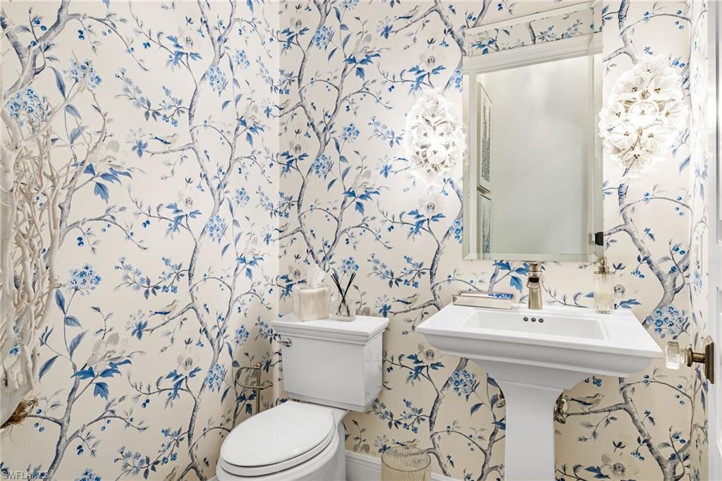 14480 Marsala Way Naples, FL 34109 - Photo 22 of 31 a bathroom with a sink and toilet